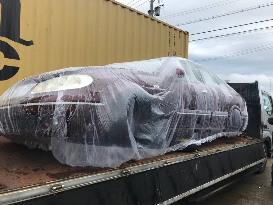 Whole used cars wrapped & ready for export